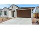 Charming home featuring a low-maintenance landscape and a two-car garage at 23404 W Burton Ave, Buckeye, AZ 85326