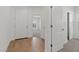 Bright and airy foyer featuring wood-look floors leading to other rooms at 23404 W Burton Ave, Buckeye, AZ 85326
