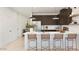 Modern kitchen featuring a large island with barstool seating, stainless steel appliances, and sleek cabinetry at 23404 W Burton Ave, Buckeye, AZ 85326