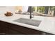 Granite countertop showcasing a stainless steel undermount sink and a stylish faucet in a modern kitchen setting at 23404 W Burton Ave, Buckeye, AZ 85326
