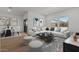 Comfortable living room with large windows and stylish furnishings, perfect for relaxation and casual gatherings at 23404 W Burton Ave, Buckeye, AZ 85326