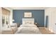Serene main bedroom with a bed, chaise lounge, neutral decor, and plenty of natural light at 23404 W Burton Ave, Buckeye, AZ 85326