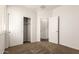 Bright bedroom with neutral paint, carpet, closet, and connecting doorway at 2554 E Vermont Dr, Gilbert, AZ 85295
