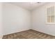 Empty bedroom with a ceiling fan and a big window at 2554 E Vermont Dr, Gilbert, AZ 85295