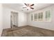 Bedroom with a ceiling fan, a neutral color palette, and a closet at 2554 E Vermont Dr, Gilbert, AZ 85295