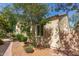 Side view of home showcasing desert landscaping and a private, brick-walled yard at 2554 E Vermont Dr, Gilbert, AZ 85295