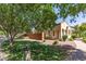 Landscaped front yard with a charming walkway leading to a well-maintained, single story home at 2554 E Vermont Dr, Gilbert, AZ 85295