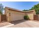 Attached two-car garage featuring a brick driveway and neutral facade at 2554 E Vermont Dr, Gilbert, AZ 85295