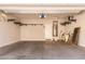 Garage with organizational shelving, a door to the home, and painted walls at 2554 E Vermont Dr, Gilbert, AZ 85295