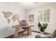 Home office with a world map, plants, light wood floors, and shutters at 2554 E Vermont Dr, Gilbert, AZ 85295