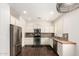 Bright kitchen boasting stainless appliances, ample cabinet space, and modern finishes at 2554 E Vermont Dr, Gilbert, AZ 85295