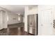 Open kitchen with stainless steel refrigerator with views of living room at 2554 E Vermont Dr, Gilbert, AZ 85295
