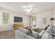 Staged living room with neutral tones, modern furniture, and lots of natural light at 2554 E Vermont Dr, Gilbert, AZ 85295