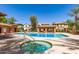 Community pool and spa surrounded by lounge chairs and cabanas at 2554 E Vermont Dr, Gilbert, AZ 85295
