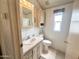 Functional bathroom featuring a vanity, toilet, and shower with storage at 272 S Cinnabar Dr, Apache Junction, AZ 85119