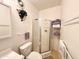Clean bathroom features a vanity, a shower stall, and shelves for ample storage at 272 S Cinnabar Dr, Apache Junction, AZ 85119