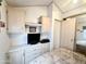 Bedroom with built-in cabinets, integrated TV space, and closet access at 272 S Cinnabar Dr, Apache Junction, AZ 85119