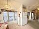 Bright dining area with large windows, a cozy table setup, and a view of the outdoors at 272 S Cinnabar Dr, Apache Junction, AZ 85119