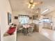 Inviting dining area with vaulted ceilings, a ceiling fan, and views into the adjacent kitchen at 272 S Cinnabar Dr, Apache Junction, AZ 85119