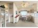 Cozy dining area features a ceiling fan, table with four chairs, and convenient built-in storage at 272 S Cinnabar Dr, Apache Junction, AZ 85119