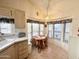 Charming dining nook with a bay window, offering natural light and pleasant views at 272 S Cinnabar Dr, Apache Junction, AZ 85119