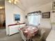 Charming dining area with natural light, complemented by artwork and cozy furnishings at 272 S Cinnabar Dr, Apache Junction, AZ 85119