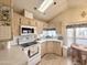 Well-lit kitchen features modern appliances, bright cabinets, and a convenient corner sink at 272 S Cinnabar Dr, Apache Junction, AZ 85119