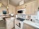 Kitchen area showcases ample counter space and open layout to the dining area at 272 S Cinnabar Dr, Apache Junction, AZ 85119
