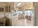 Bright kitchen featuring white appliances, ample cabinet space, and a large skylight at 272 S Cinnabar Dr, Apache Junction, AZ 85119