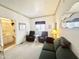 Comfortable living room features a couch, ceiling fan, and a bathroom at 272 S Cinnabar Dr, Apache Junction, AZ 85119