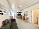 Comfortable living room with couch, patio doors, and open doorway at 272 S Cinnabar Dr, Apache Junction, AZ 85119