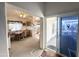 Inviting living room features views to dining area, kitchen, and outdoor seating area at 272 S Cinnabar Dr, Apache Junction, AZ 85119
