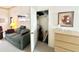 Living room view looking into an opened closet with shelving at 272 S Cinnabar Dr, Apache Junction, AZ 85119
