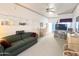 Bright living room featuring a comfortable couch, and access to the patio at 272 S Cinnabar Dr, Apache Junction, AZ 85119