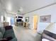 Open living room featuring neutral carpet, ceiling fan, and sliding door to outdoor patio at 272 S Cinnabar Dr, Apache Junction, AZ 85119