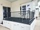 The home's covered porch includes seating, storage, and great light at 272 S Cinnabar Dr, Apache Junction, AZ 85119