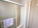 Clean shower and tub featuring sliding glass doors and a mounted shower head at 272 S Cinnabar Dr, Apache Junction, AZ 85119
