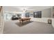 Spacious basement with a pool table, a TV, sofa, and neutral carpeting for entertaining at 2727 S Balboa Dr, Gilbert, AZ 85295