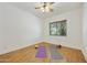 Minimalist bedroom with hardwood floors, natural light, and space for yoga at 2727 S Balboa Dr, Gilbert, AZ 85295