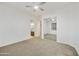 Bright bedroom with neutral carpet and closet with mirrored doors; bathroom is visible through a doorway at 2727 S Balboa Dr, Gilbert, AZ 85295