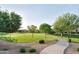Well-maintained community greenbelt with mature trees and a winding pathway, perfect for leisurely strolls at 2727 S Balboa Dr, Gilbert, AZ 85295