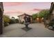 Private courtyard with a tiered fountain, stone pavers, and beautiful plantings, offering a tranquil retreat at 2727 S Balboa Dr, Gilbert, AZ 85295