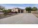Exterior view features a well-maintained driveway, desert landscaping, and a charming façade in this well-appointed home at 2727 S Balboa Dr, Gilbert, AZ 85295