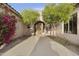 Inviting front entrance with mature trees and desert landscaping adding curb appeal to this charming home at 2727 S Balboa Dr, Gilbert, AZ 85295
