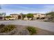 A charming single-story home featuring a lush, landscaped front yard and a circular paver driveway at 2727 S Balboa Dr, Gilbert, AZ 85295