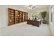 Well-appointed home office with custom built-in bookshelves and a large desk, perfect for remote work at 2727 S Balboa Dr, Gilbert, AZ 85295