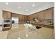 Gourmet kitchen featuring stainless steel appliances, granite countertops, and custom wood cabinetry at 2727 S Balboa Dr, Gilbert, AZ 85295