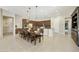 Large open kitchen with an island, long dining table with seating for ten, and plenty of cabinet space at 2727 S Balboa Dr, Gilbert, AZ 85295