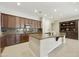 Spacious kitchen featuring granite countertops, custom wood cabinets, stainless appliances and ample island seating at 2727 S Balboa Dr, Gilbert, AZ 85295