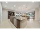 Bright, open kitchen featuring granite countertops, an island, stainless steel appliances, and an adjacent dining area at 2727 S Balboa Dr, Gilbert, AZ 85295
